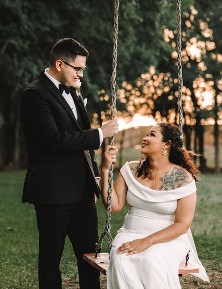 wedding sunset photos with bride and groom on swing at Texas Old Town - Sage Hall